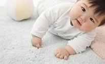 child playing on carpet